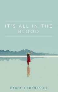 Cover design for 'It's All In The Blood'. A woman in a red dress and a straw hat, walking away from the viewer across a shallow body of water, towards mountains in the distance.